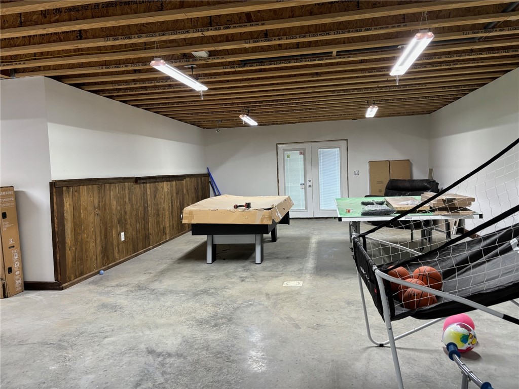 172 Hawks Road Pittsfield, NY 13411 - Photo 29 of 45 Partially Finished Basement with French door to ou
