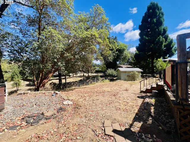 a view of a yard with snow on the road