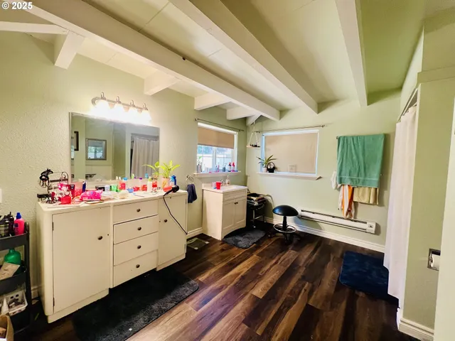 a room with furniture and wooden floor