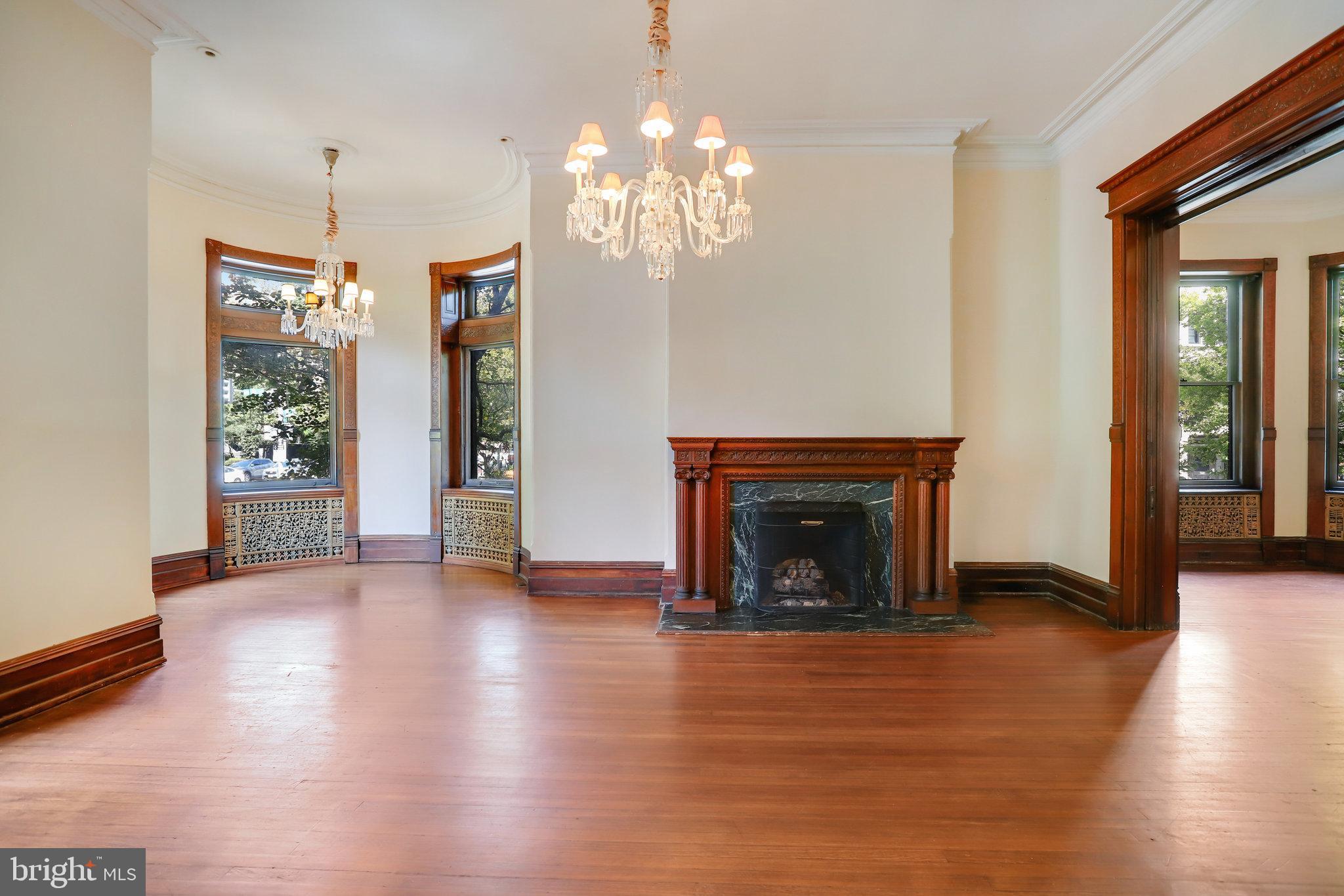 1633 16th Street Northwest Washington, DC 20009 - Photo 13 of 130 a view of a livingroom with a fireplace window and wooden floor