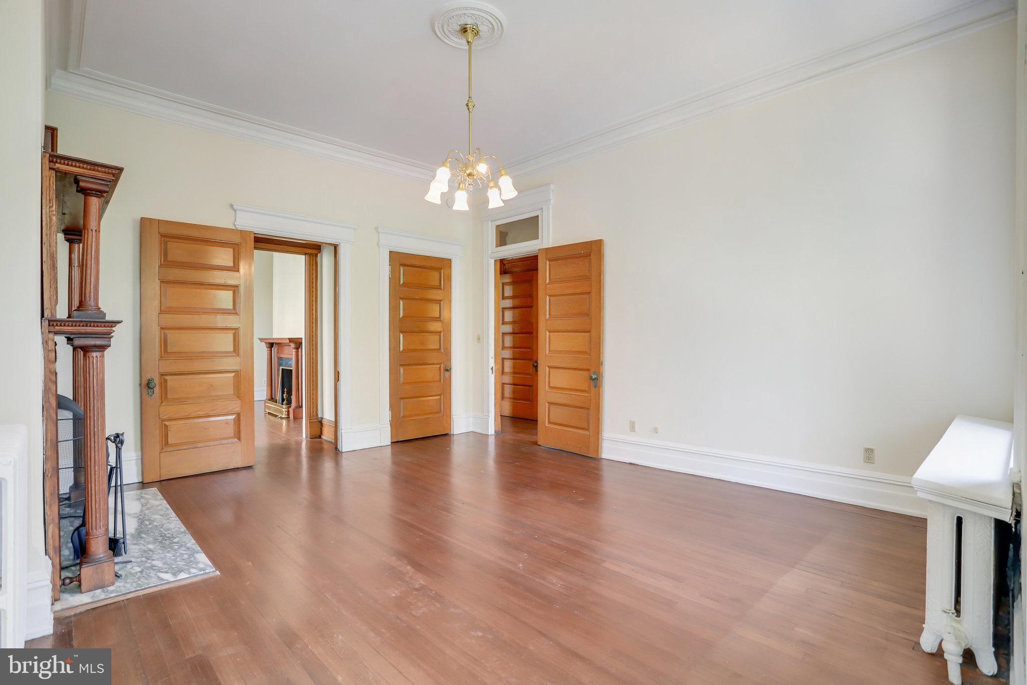 1633 16th Street Northwest Washington, DC 20009 - Photo 44 of 130 a view of a livingroom with wooden floor and a ceiling fan