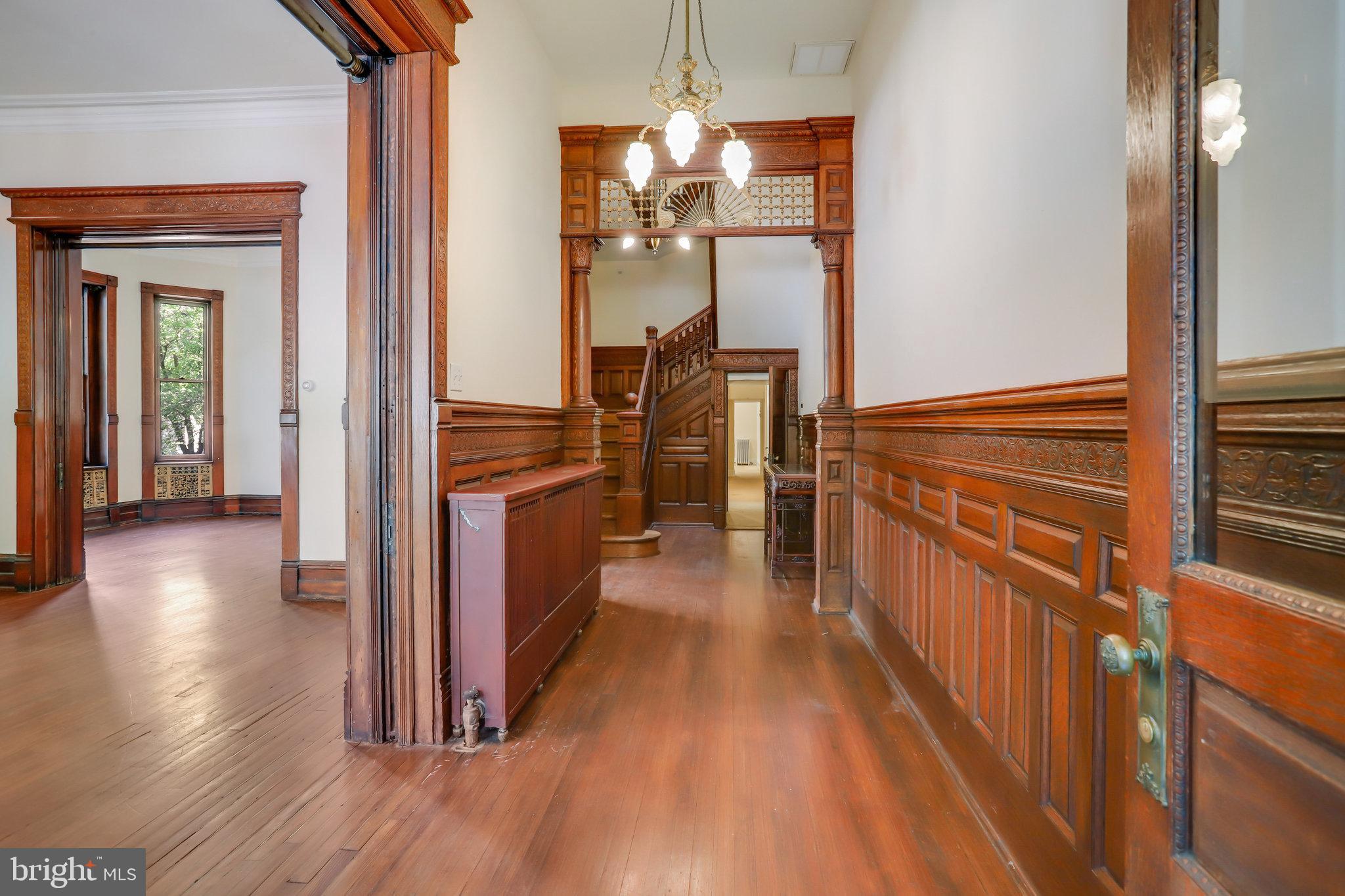 1633 16th Street Northwest Washington, DC 20009 - Photo 5 of 130 a view of a hallway view with wooden floor and staircase