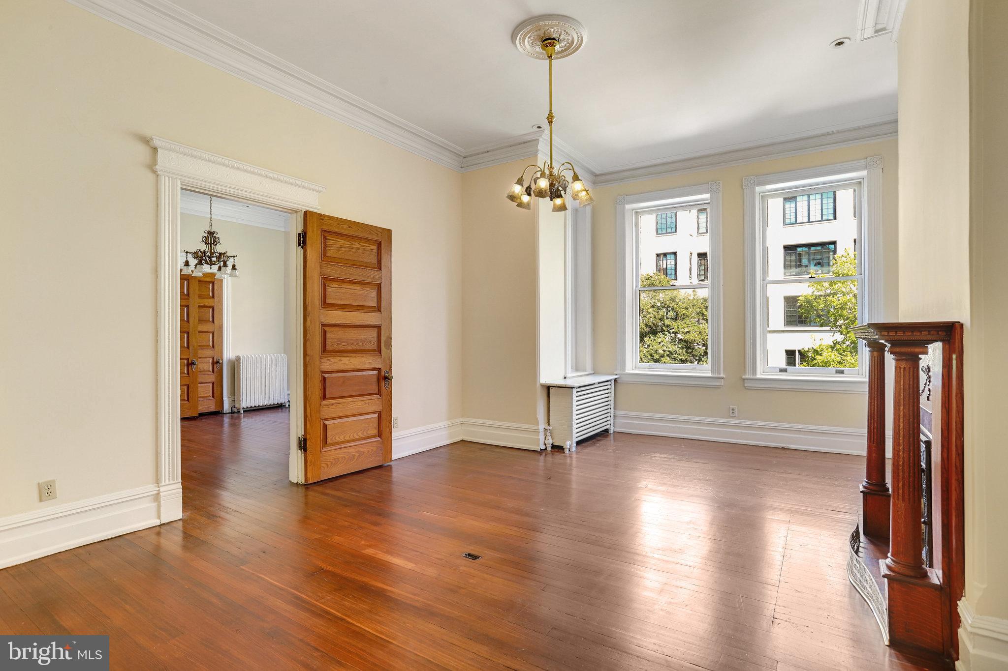 1633 16th Street Northwest Washington, DC 20009 - Photo 53 of 130 a view of empty room with wooden floor and window