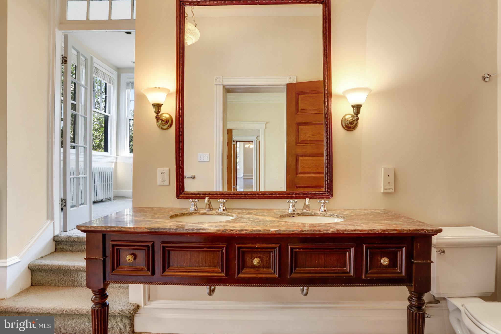 1633 16th Street Northwest Washington, DC 20009 - Photo 56 of 130 a bathroom with a sink and a mirror