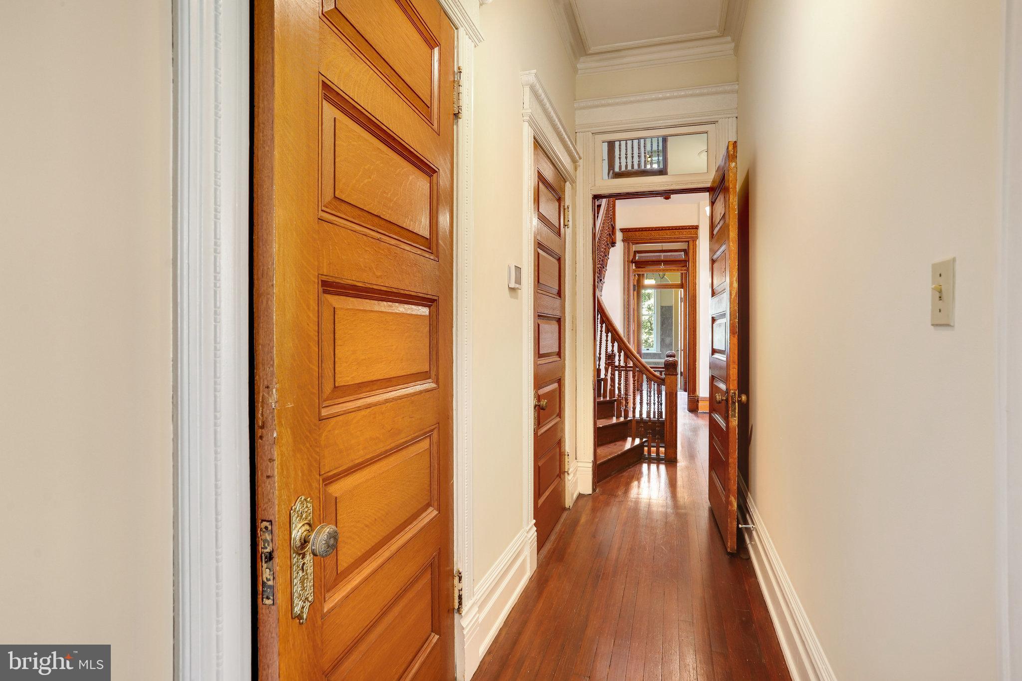 1633 16th Street Northwest Washington, DC 20009 - Photo 62 of 130 a view of a hallway with wooden floor and a bathroom