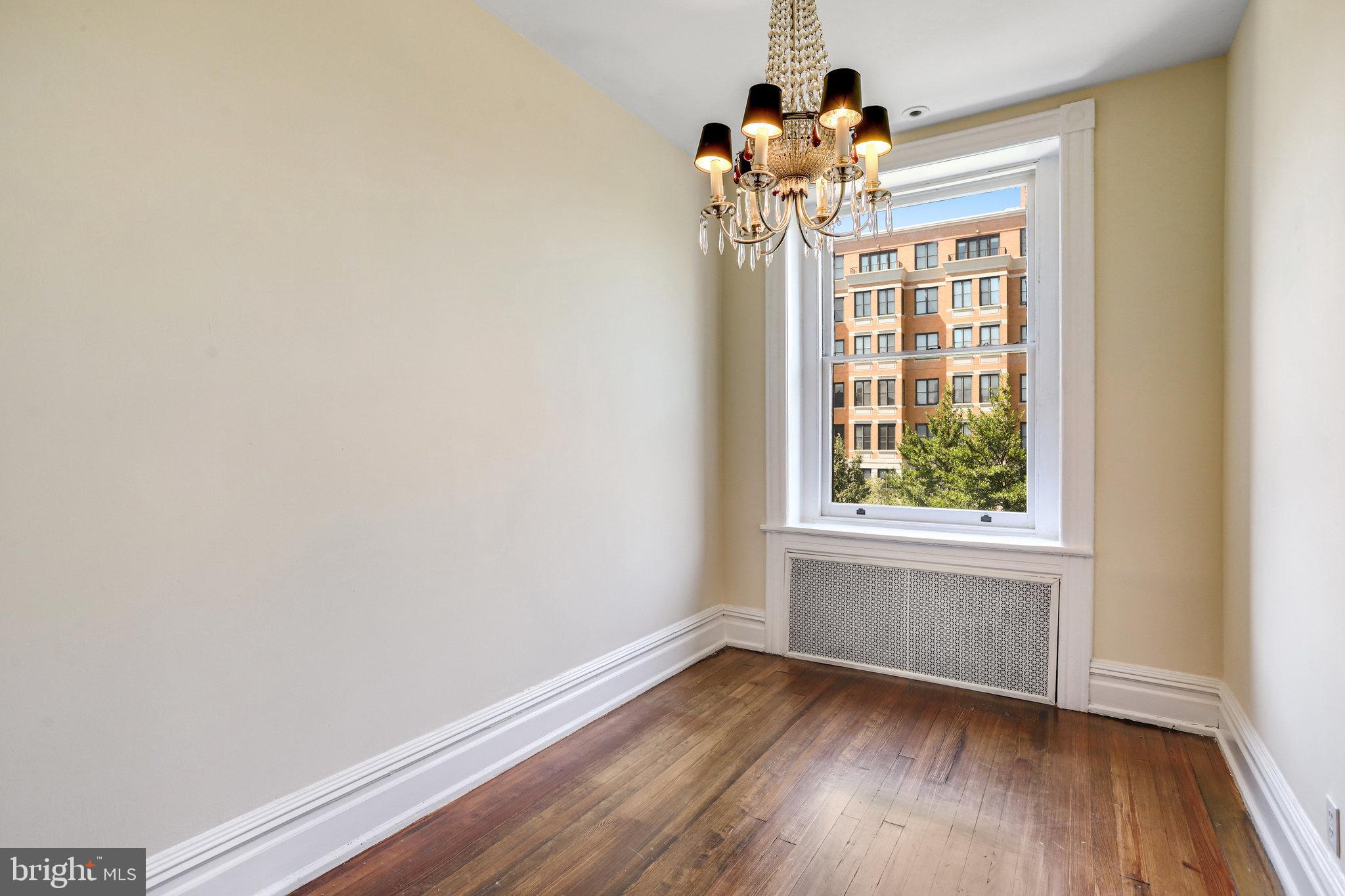 1633 16th Street Northwest Washington, DC 20009 - Photo 64 of 130 wooden floor in an empty room with a window