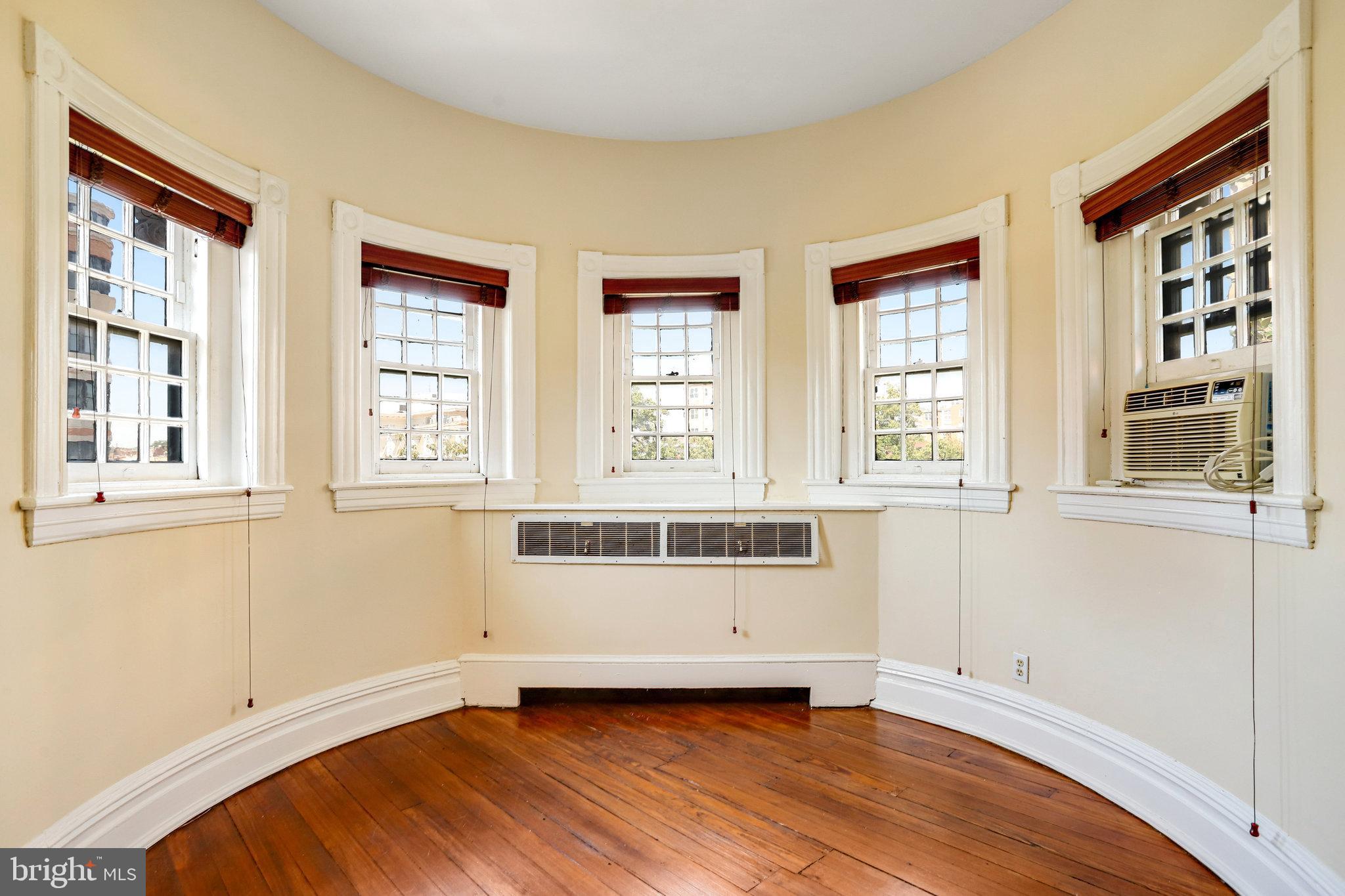 1633 16th Street Northwest Washington, DC 20009 - Photo 90 of 130 a view of an empty room with a window and wooden floor