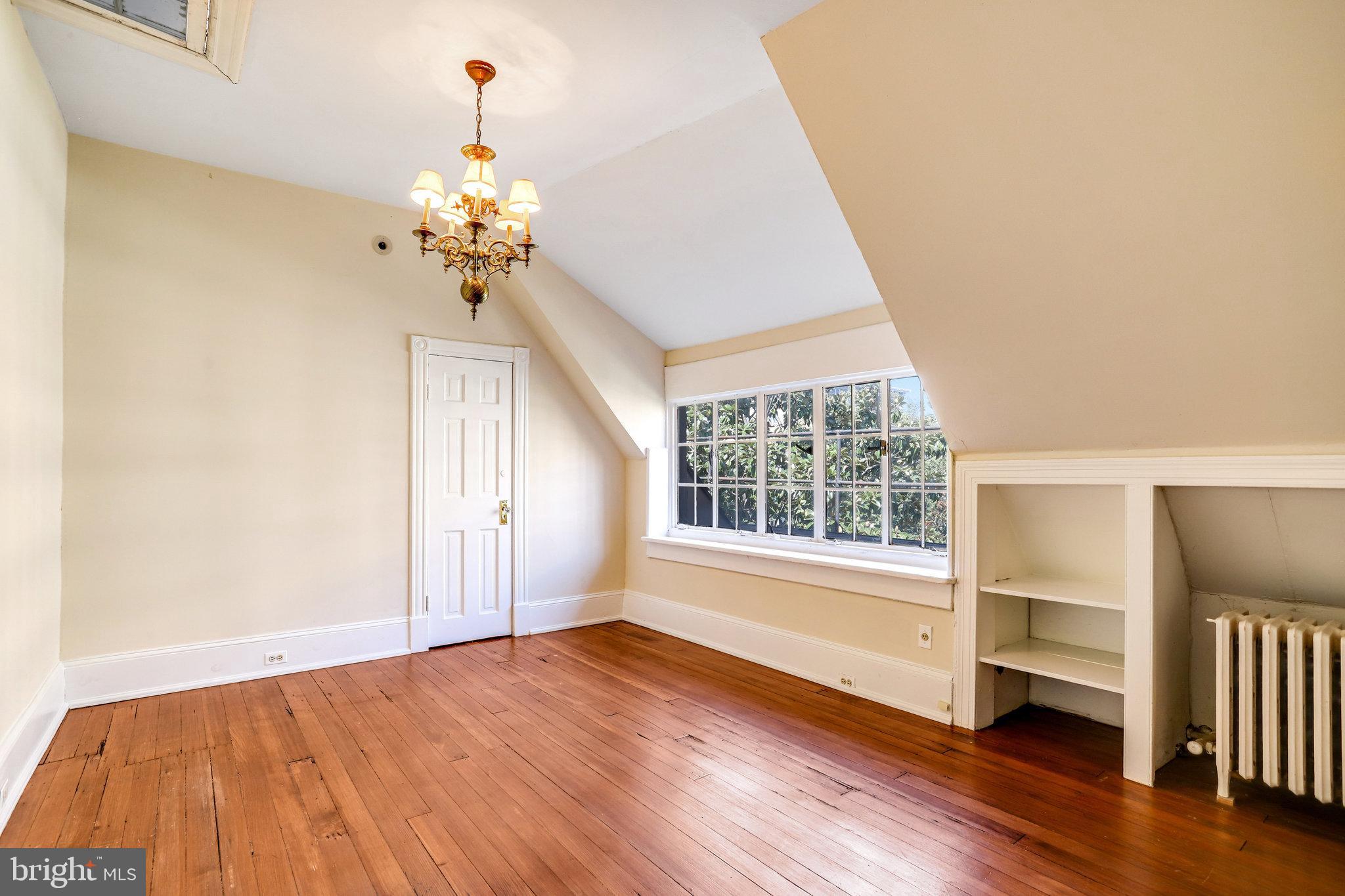 1633 16th Street Northwest Washington, DC 20009 - Photo 93 of 130 a view of an empty room with a window and wooden floor