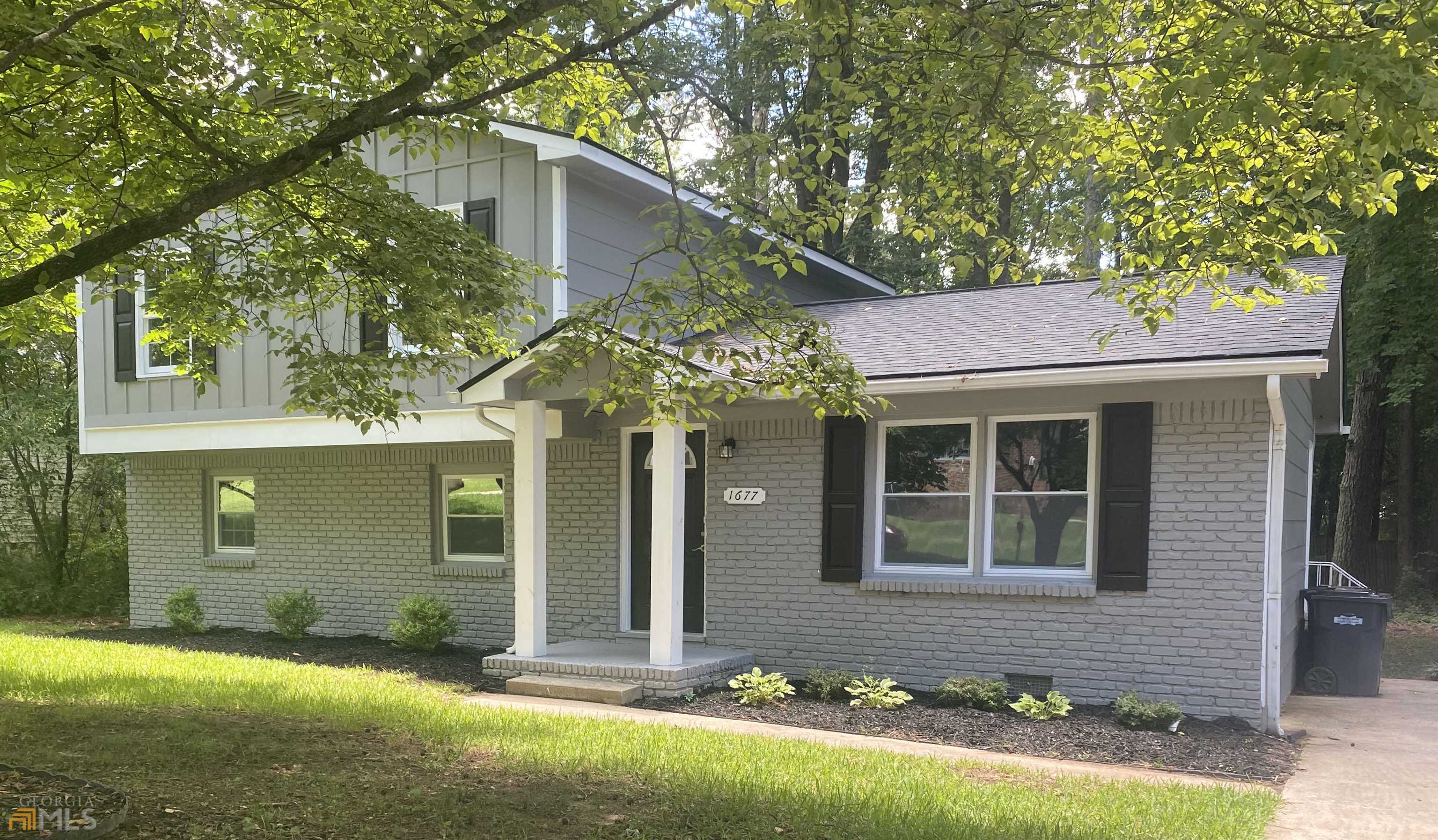 1677 Spoonbill Road Hampton, GA 30228 - Photo 1 of 1 a front view of a house with a yard