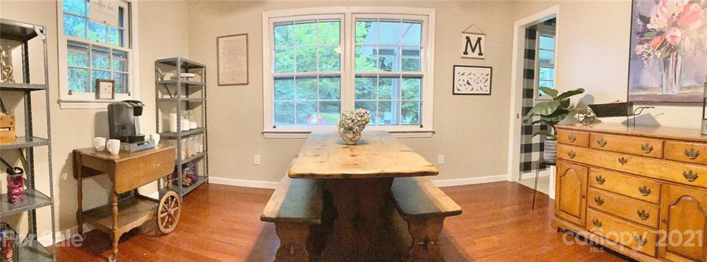 181 Echo Drive Laurel Park, NC 28739 - Photo 7 of 28 a dining room with furniture and a floor to ceiling window