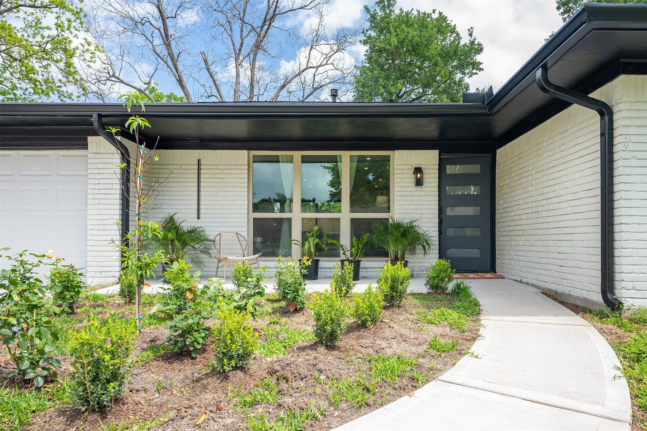 5326 Carew Street Houston, TX 77096 - Photo 2 of 30 a front view of a house with garden