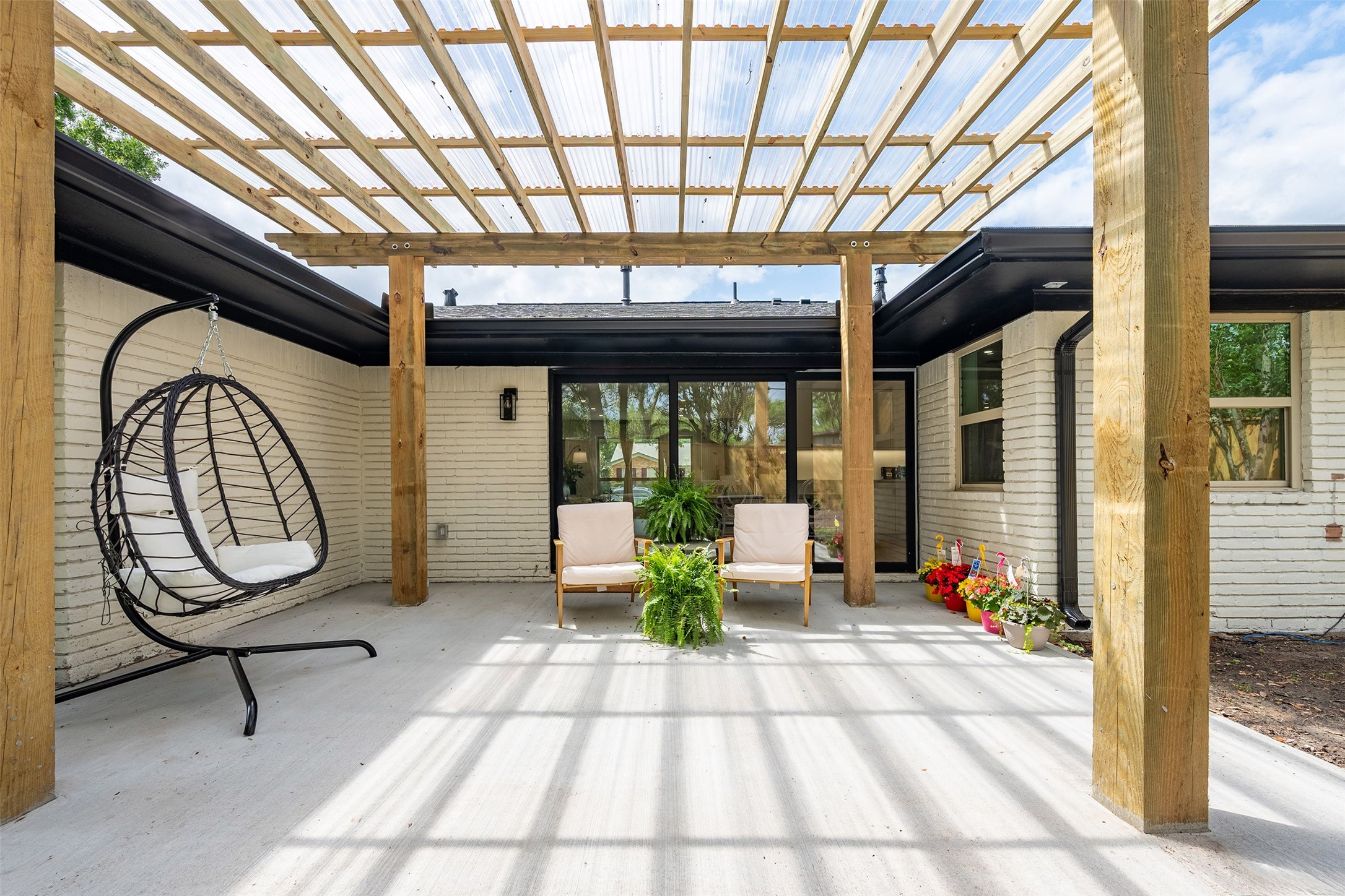 5326 Carew Street Houston, TX 77096 - Photo 27 of 30 a porch with chairs and a table