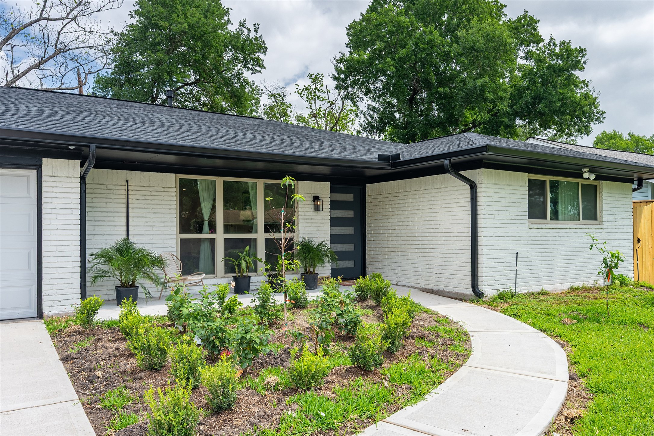 5326 Carew Street Houston, TX 77096 - Photo 3 of 30 a house with a garden view