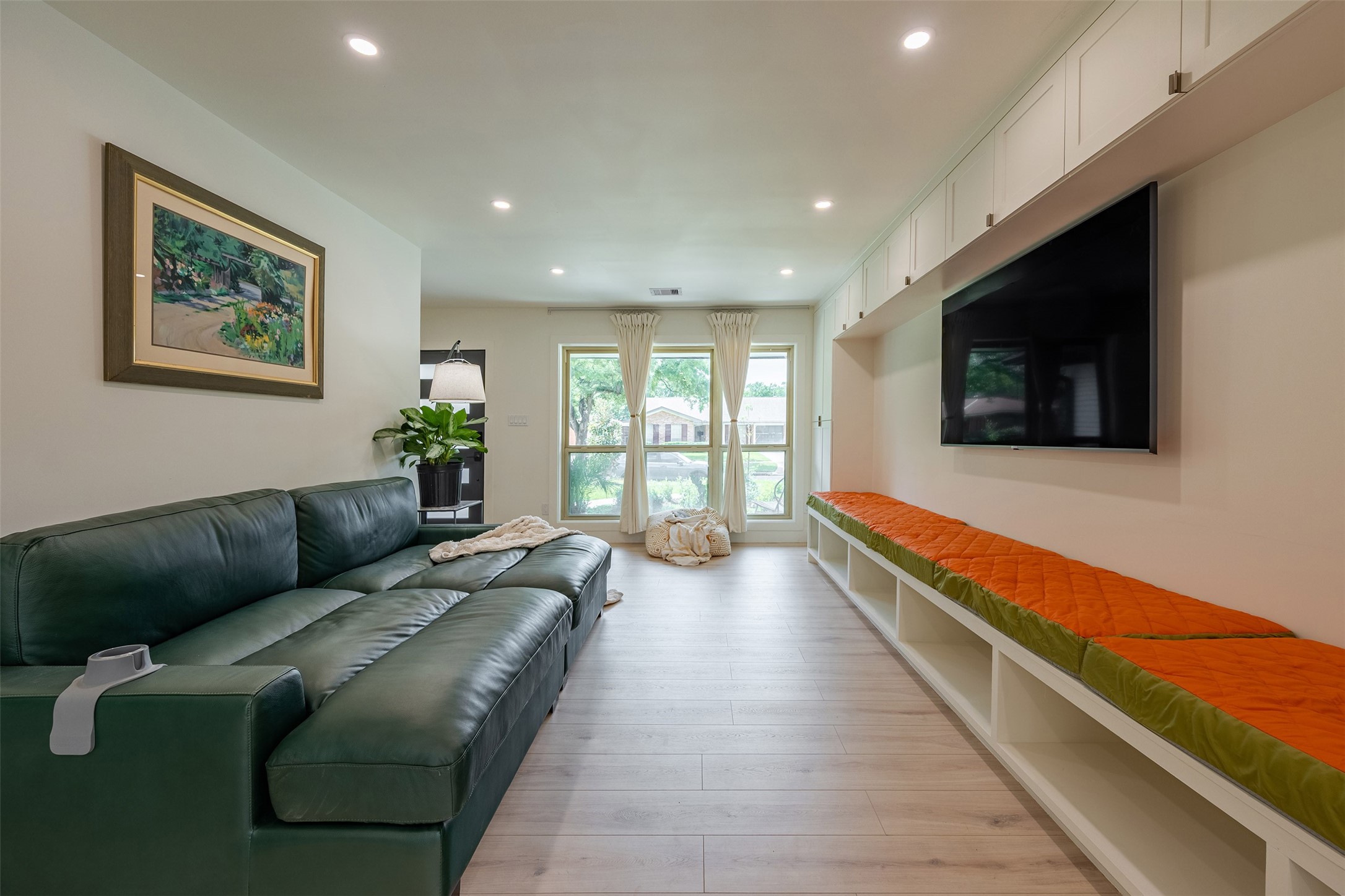 5326 Carew Street Houston, TX 77096 - Photo 4 of 30 a living room with furniture and a flat screen tv