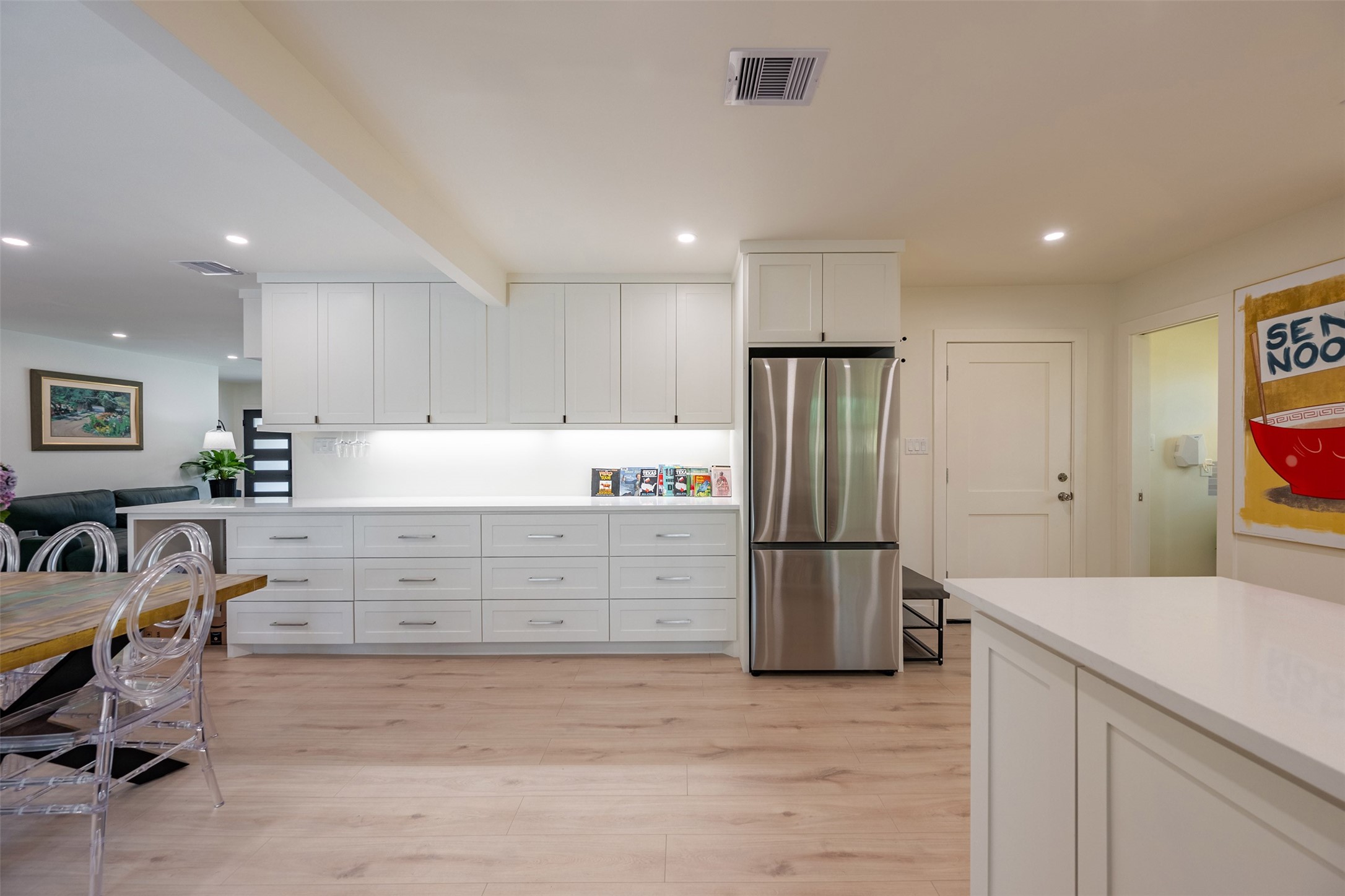 5326 Carew Street Houston, TX 77096 - Photo 10 of 30 a kitchen with a refrigerator and a stove top oven
