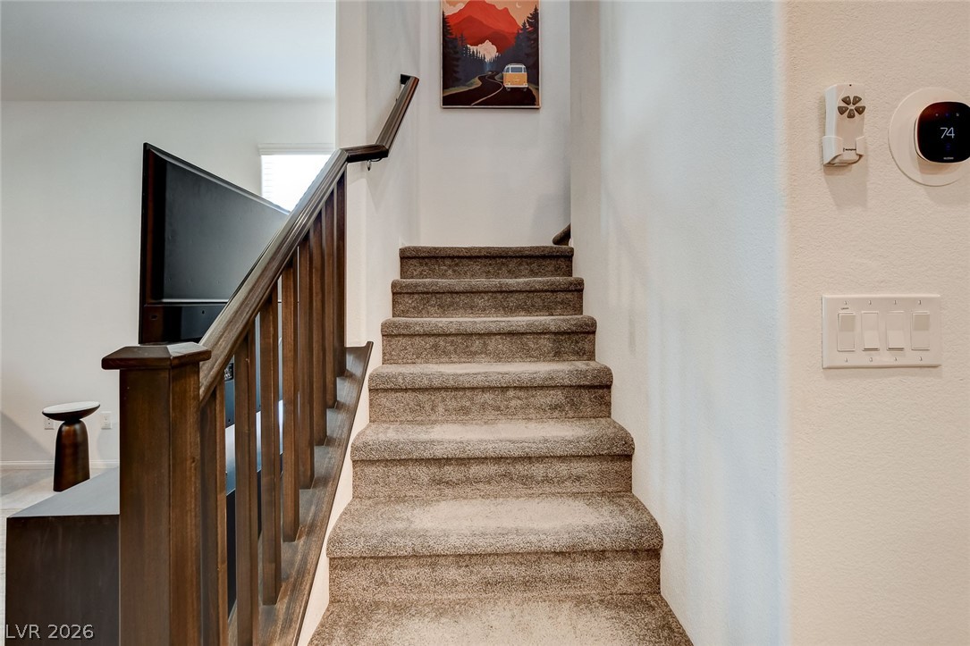 484 Filaree Place Henderson, NV 89015 - Photo 24 of 71 This staircase provides a smooth transition between levels.