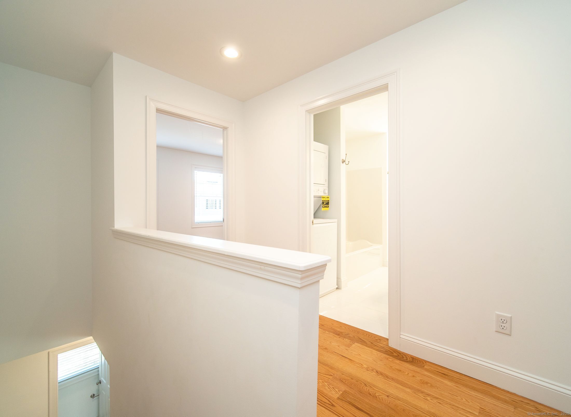 10 Fort Hill Road, Unit 3B Groton, CT 06340 - Photo 11 of 24 a view of a room that has a sink and wooden floor
