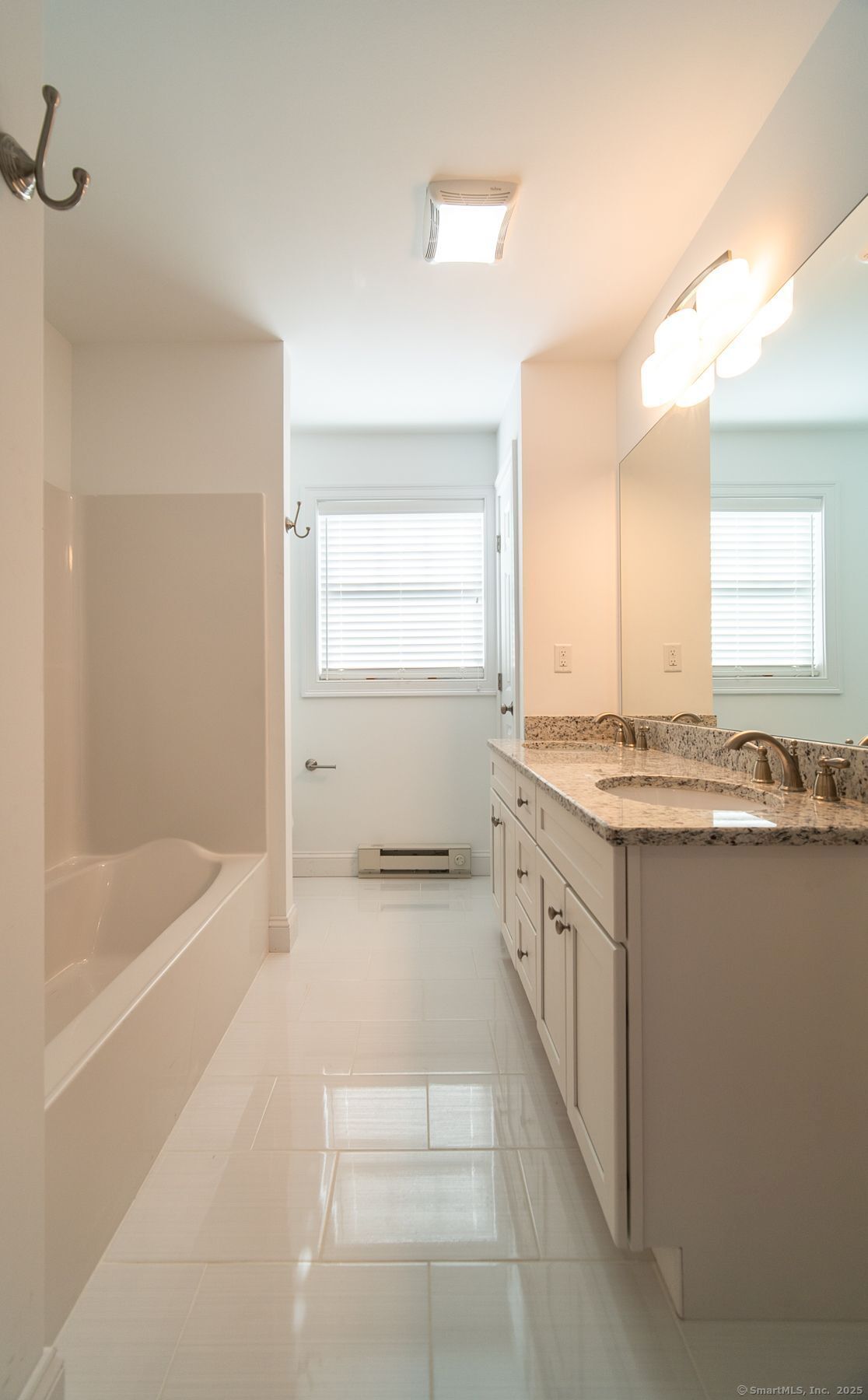 10 Fort Hill Road, Unit 3B Groton, CT 06340 - Photo 15 of 24 a bathroom with a granite countertop sink a toilet and bathtub