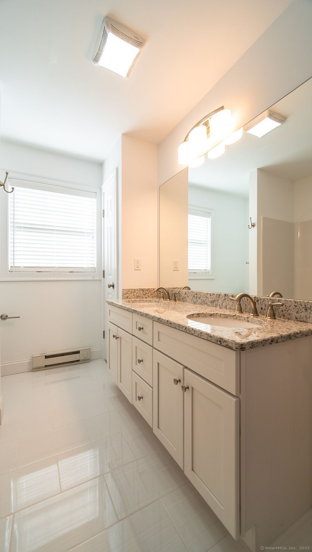 10 Fort Hill Road, Unit 3B Groton, CT 06340 - Photo 17 of 24 a large bathroom with a granite countertop sink and a mirror