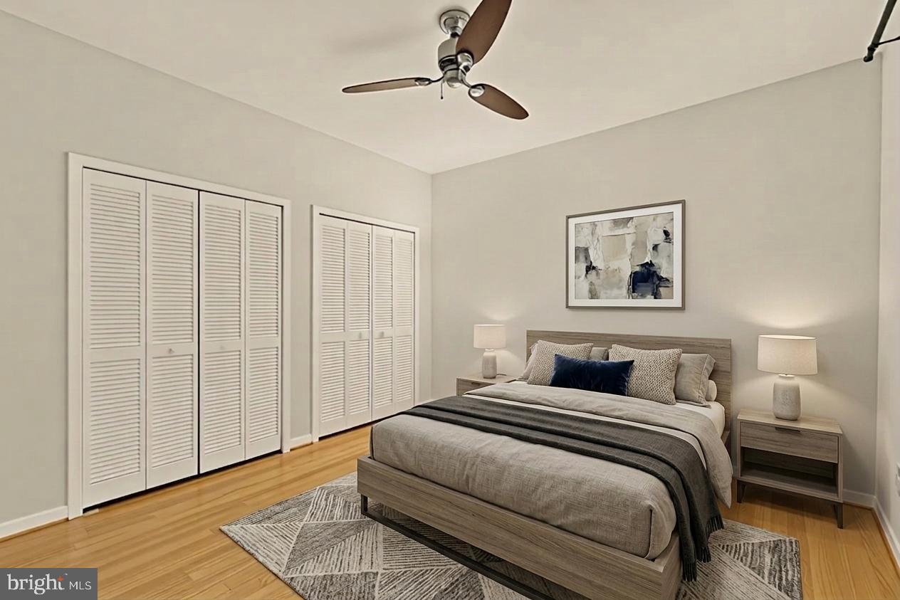 2114 N Street Northwest, Unit 11 Washington, DC 20037 - Photo 16 of 23 a bedroom with a large bed and a ceiling fan