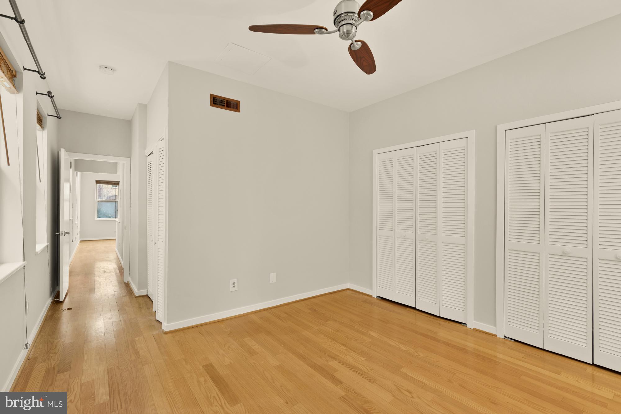 2114 N Street Northwest, Unit 11 Washington, DC 20037 - Photo 17 of 23 a view of a room with wooden floor closet and windows