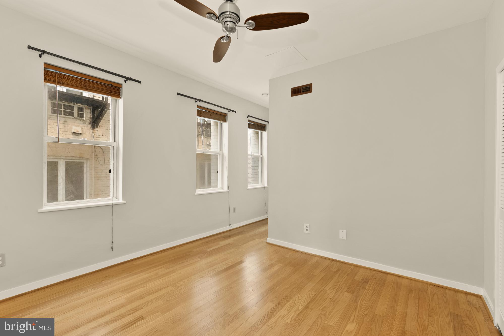 2114 N Street Northwest, Unit 11 Washington, DC 20037 - Photo 18 of 23 a view of an empty room with a window