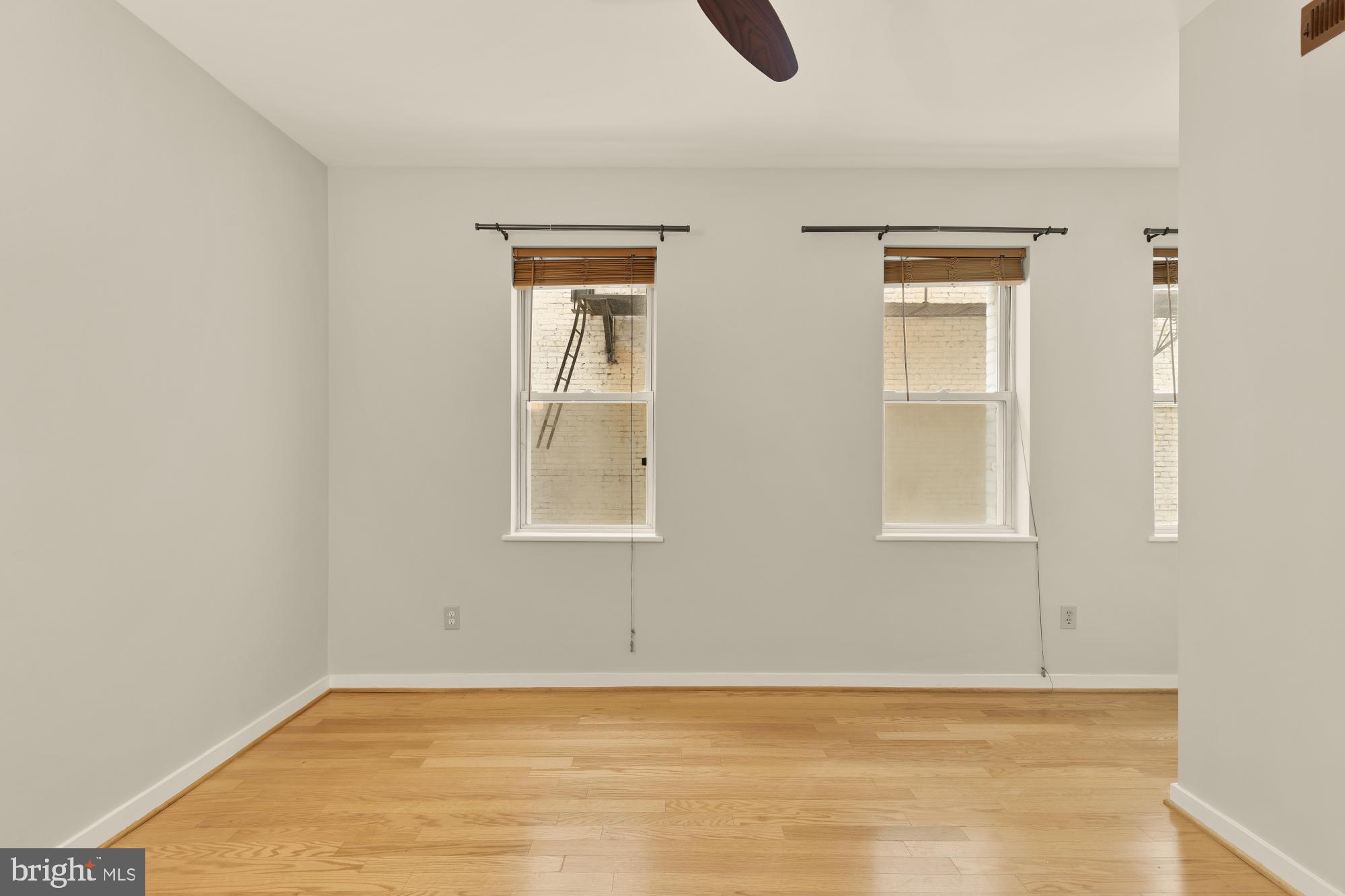 2114 N Street Northwest, Unit 11 Washington, DC 20037 - Photo 19 of 23 a view of an empty room with window and closet area
