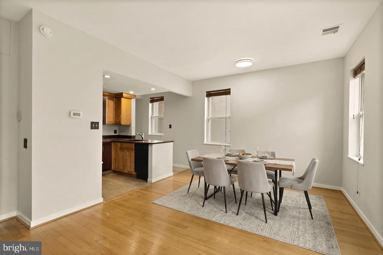 2114 N Street Northwest, Unit 11 Washington, DC 20037 - Photo 6 of 23 a view of a dining room with furniture