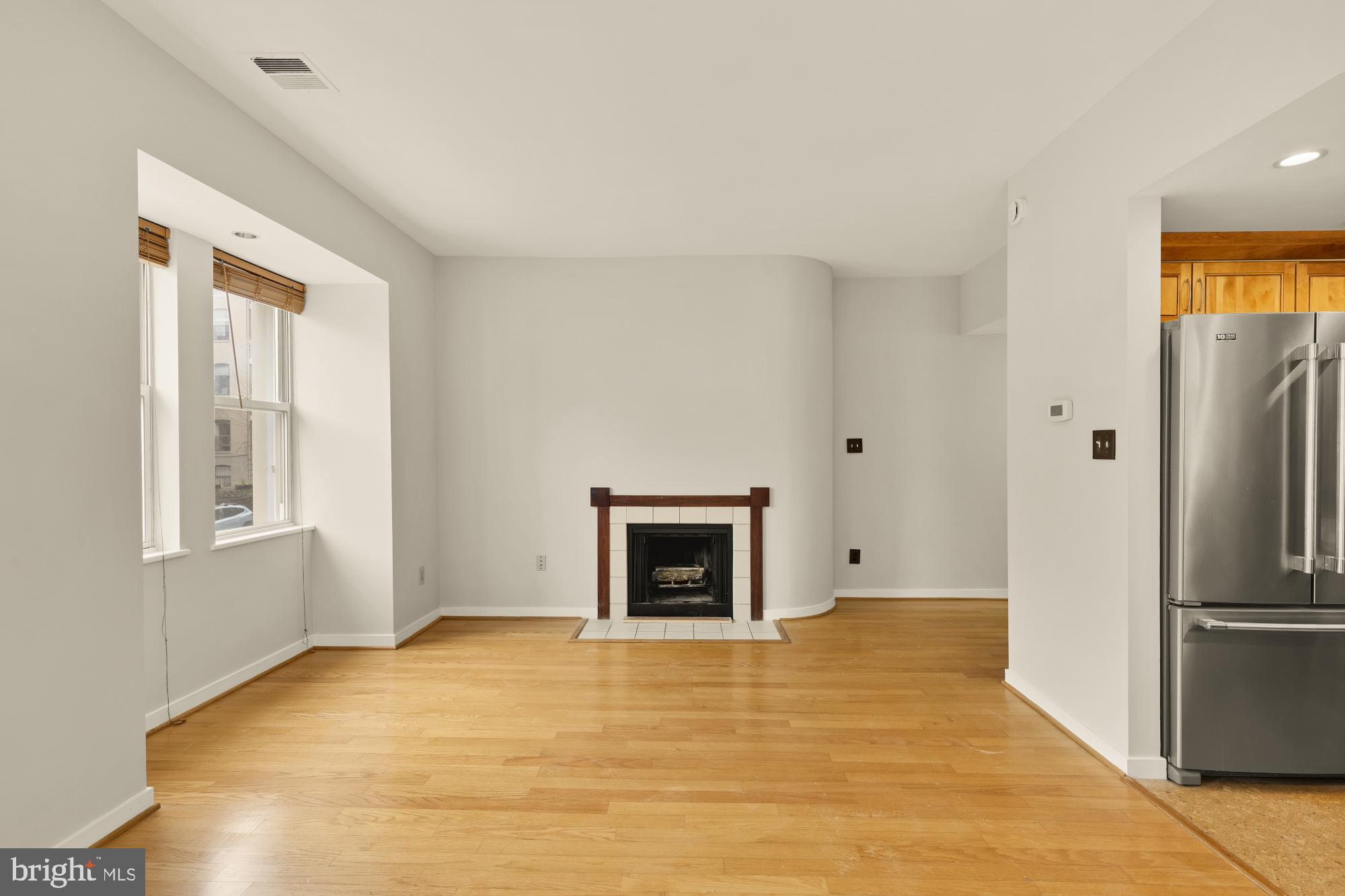 2114 N Street Northwest, Unit 11 Washington, DC 20037 - Photo 8 of 23 a view of empty room with a fireplace