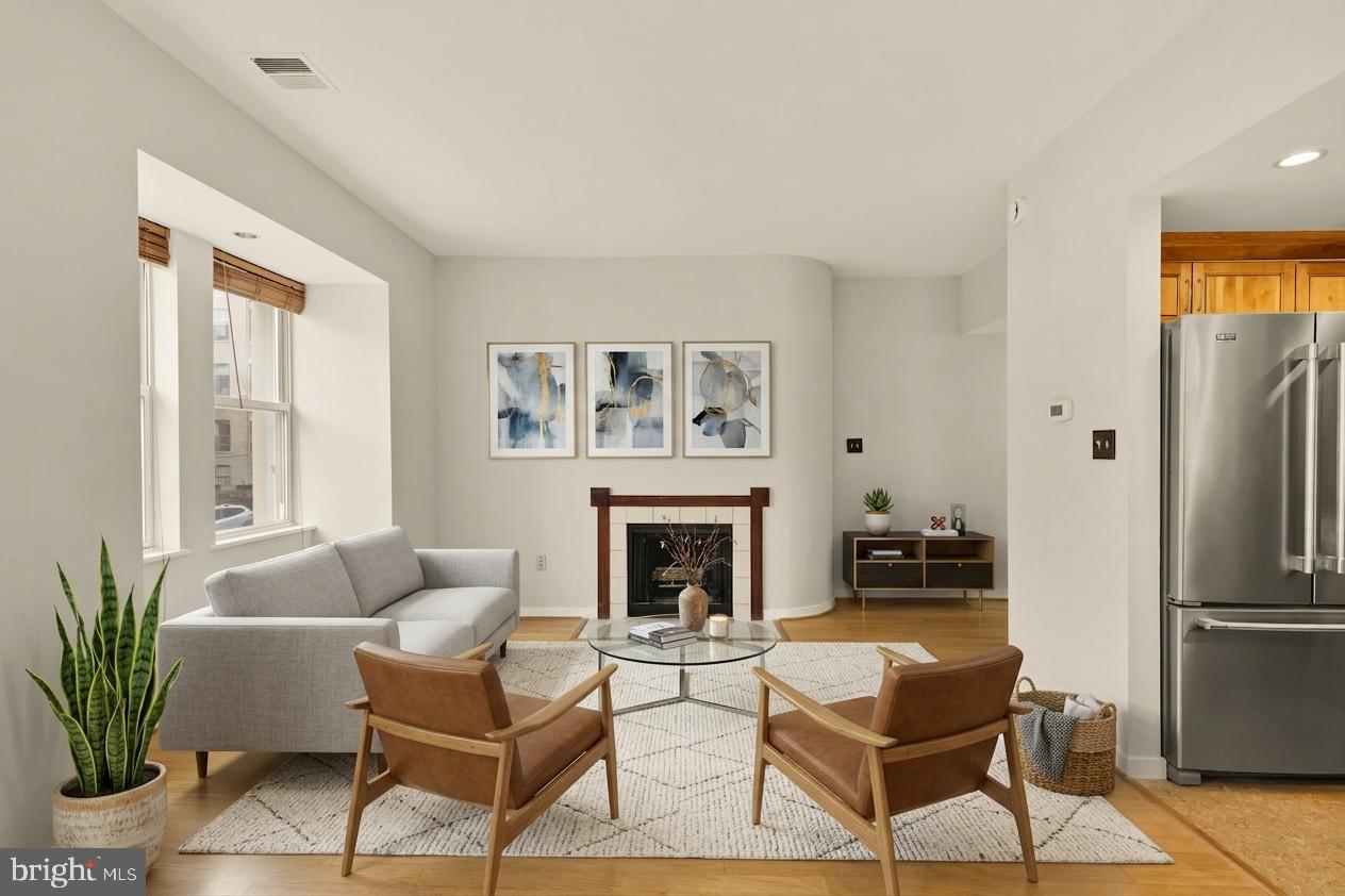 2114 N Street Northwest, Unit 11 Washington, DC 20037 - Photo 9 of 23 a living room with furniture fireplace and potted plant