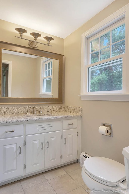 17 Janes Road Boxford, MA 01921 - Photo 18 of 29 a bathroom with a granite countertop toilet sink and mirror