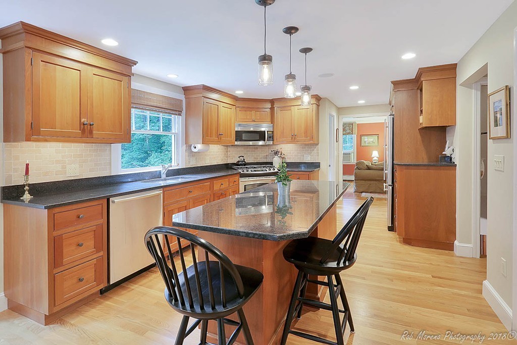 17 Janes Road Boxford, MA 01921 - Photo 4 of 29 a kitchen with stainless steel appliances granite countertop table chairs sink and cabinets