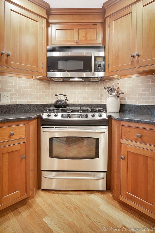 17 Janes Road Boxford, MA 01921 - Photo 8 of 29 a stove top oven sitting inside of a kitchen