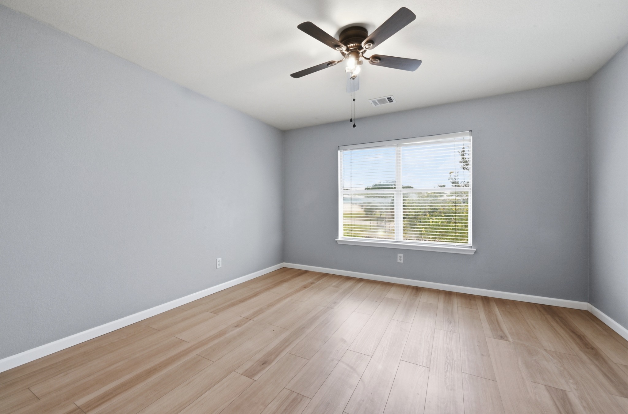 2700 Cradlerock Terrace Austin, TX 78748 - Photo 21 of 29 wooden floor in an empty room with a window