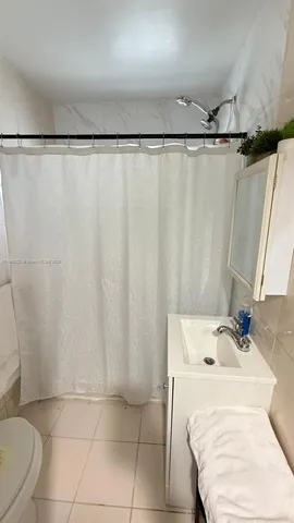 a living room with a flat screen tv and a fireplace