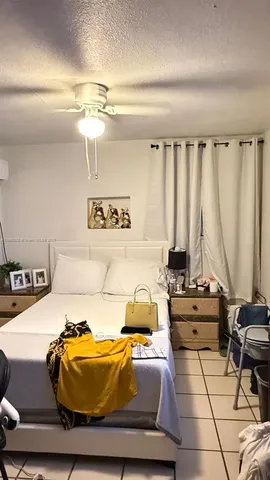 a kitchen with a table and white walls
