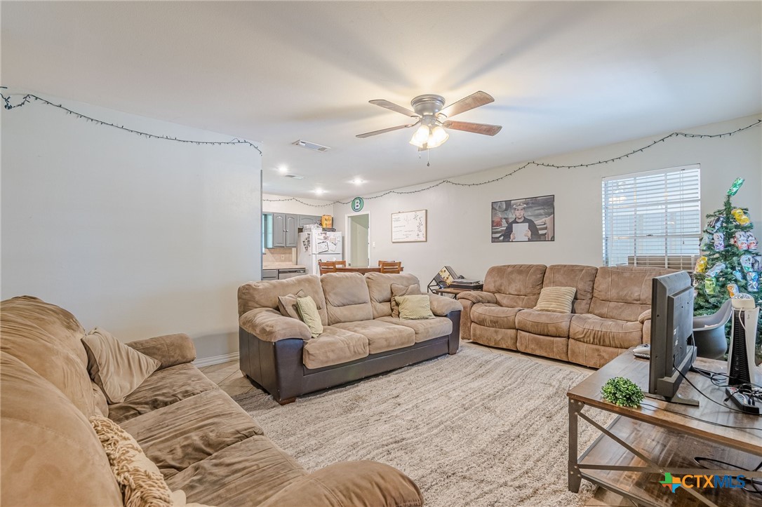 133 Algarita Road San Marcos, TX 78666 - Photo 16 of 43 a living room with furniture and a large window