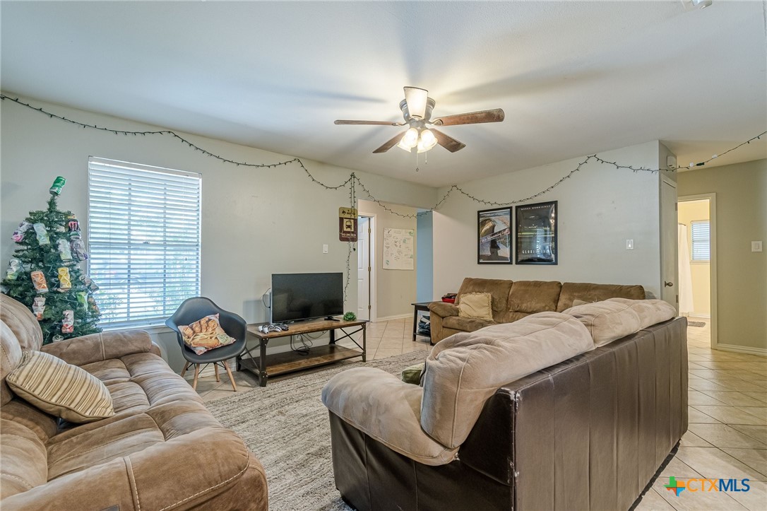 133 Algarita Road San Marcos, TX 78666 - Photo 17 of 43 a living room with furniture ceiling fan and a window