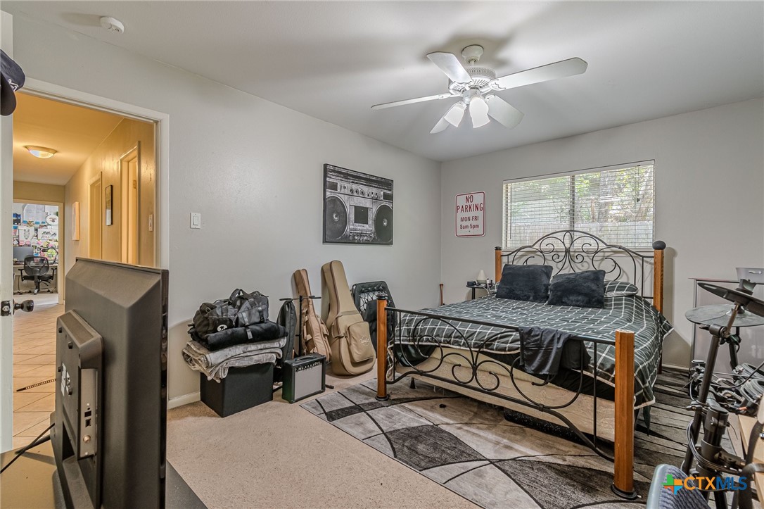 133 Algarita Road San Marcos, TX 78666 - Photo 30 of 43 a living room with furniture and a chandelier