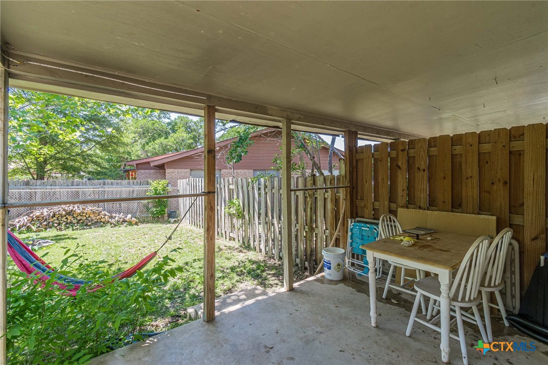 133 Algarita Road San Marcos, TX 78666 - Photo 35 of 43 a view of a chairs and table in the patio