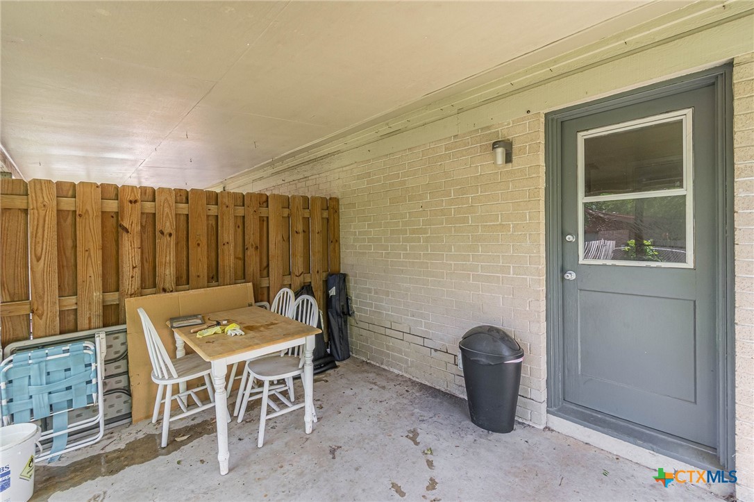 133 Algarita Road San Marcos, TX 78666 - Photo 38 of 43 a backyard of a house with table and chairs