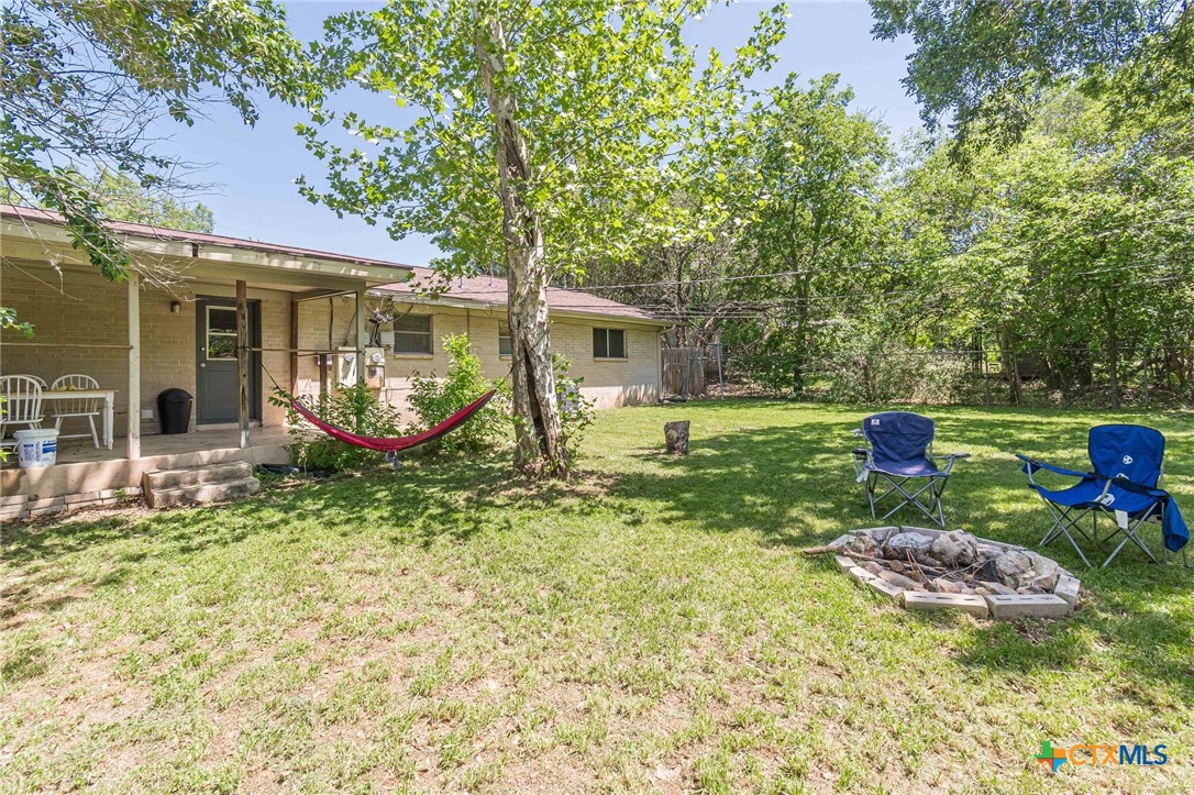 133 Algarita Road San Marcos, TX 78666 - Photo 40 of 43 a view of a chair and table in backyard of the house