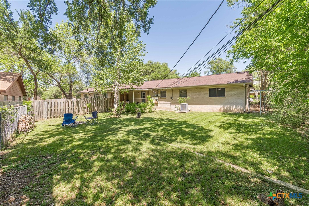 133 Algarita Road San Marcos, TX 78666 - Photo 42 of 43 a view of a house with backyard and sitting area