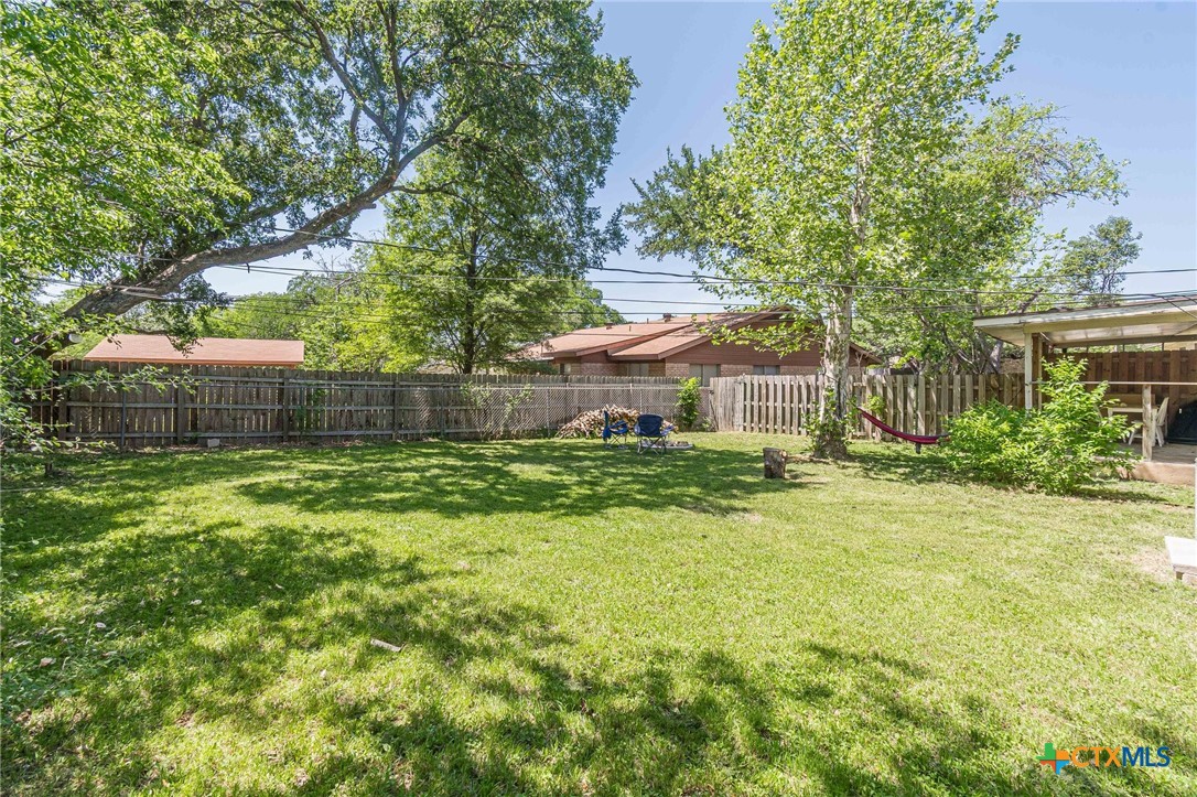 133 Algarita Road San Marcos, TX 78666 - Photo 43 of 43 a front view of a house with a yard