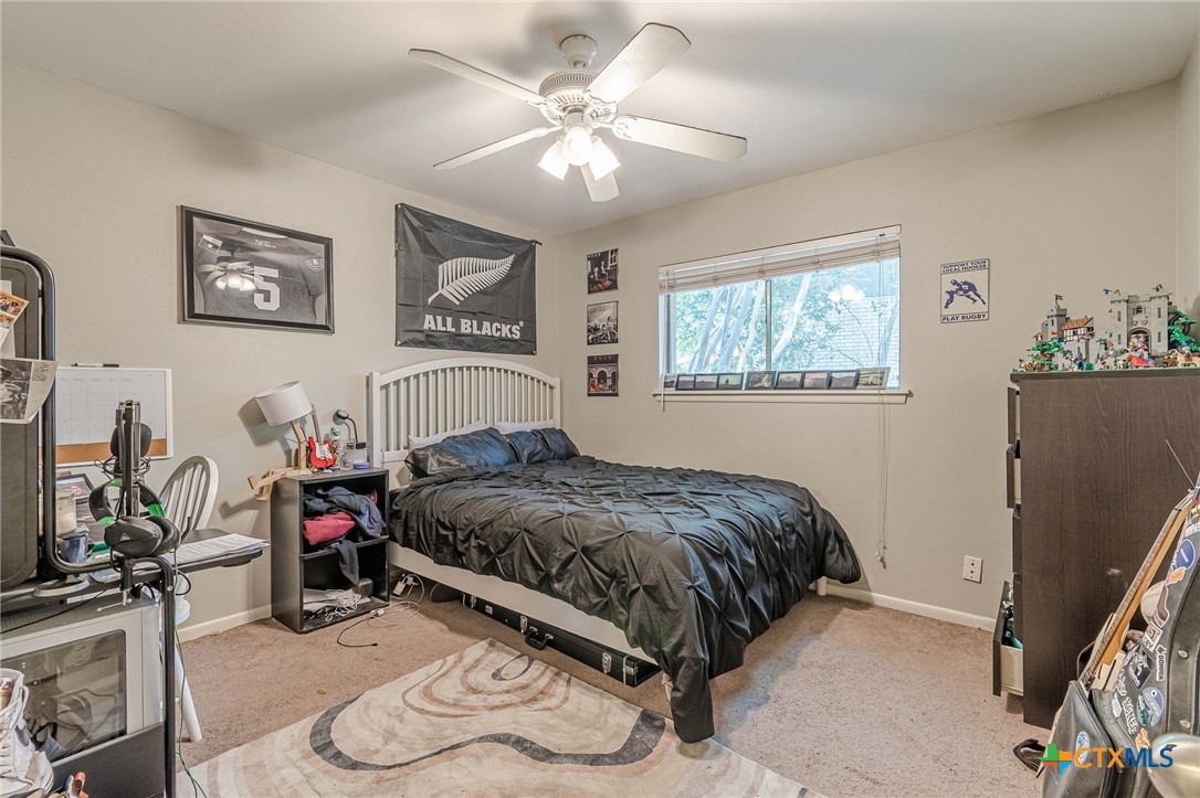 133 Algarita Road San Marcos, TX 78666 - Photo 10 of 43 a bedroom with bed and a window