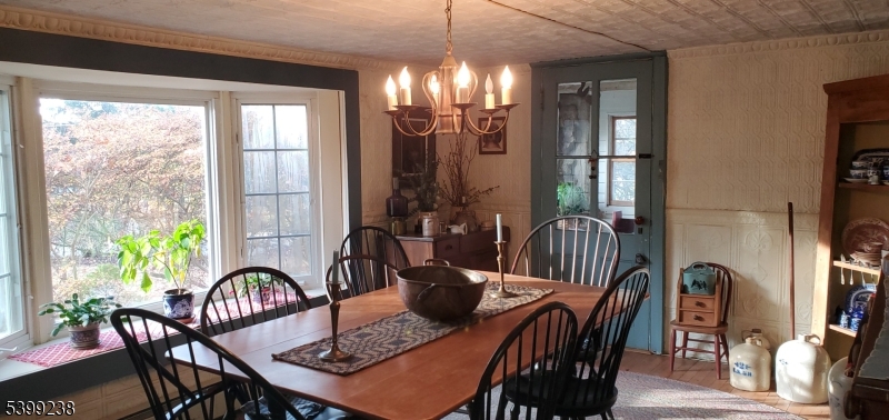 148 Mt Grove Road Califon, NJ 07830 - Photo 7 of 18 a view of a a dining room with furniture window and wooden floor