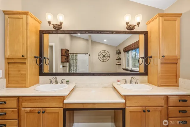 a bathroom with a sink and a mirror