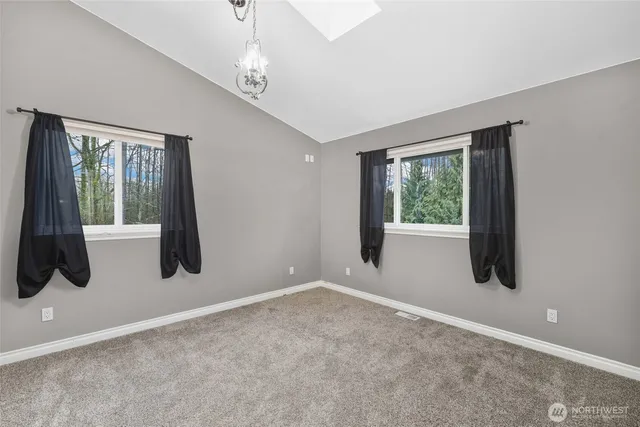 a view of entryway with window and hallway