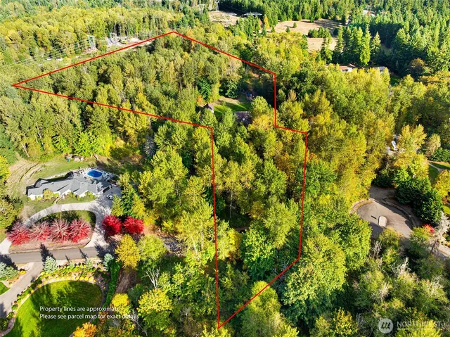 a view of house with backyard