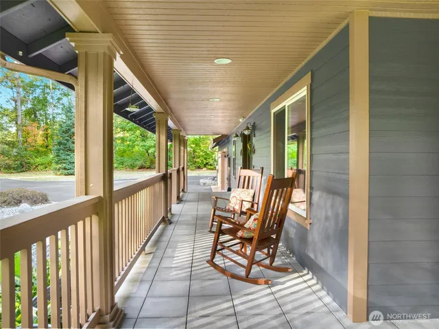 a view of two chairs in the balcony